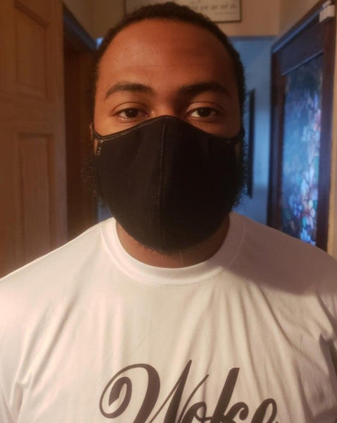 African American young man wearing black face mask.